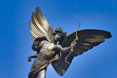Close-up of the eros statue in piccadilly circus, london, uk.