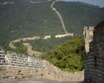 Great wall of china leading towards mountain