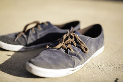 Close-up of black shoes on table