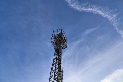 Low angle view of communications tower against sky