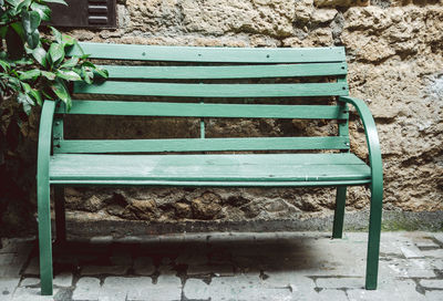 High angle view of empty bench in park