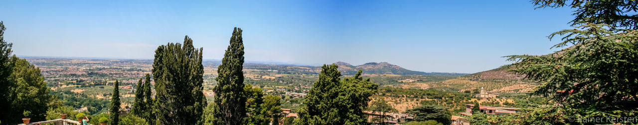 Scenic view of landscape against clear blue sky