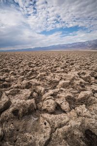 Scenic view of sand against sky