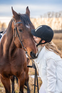 Rear view of horse standing on field