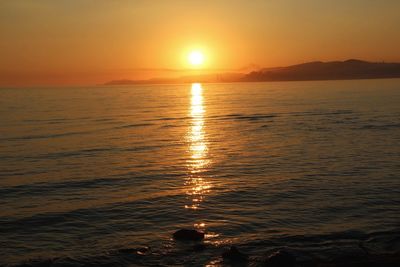 Scenic view of sea against sky during sunset