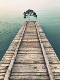 Pier over sea against sky