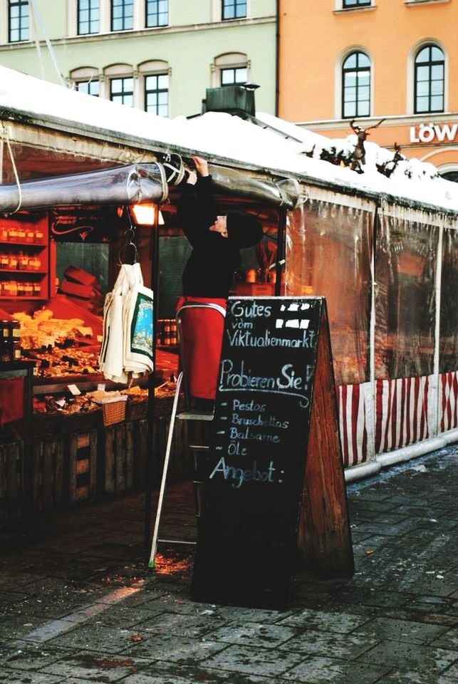 text, building exterior, built structure, architecture, western script, communication, store, retail, food and drink, non-western script, day, city, outdoors, market stall, information, hanging, information sign, red, market, no people