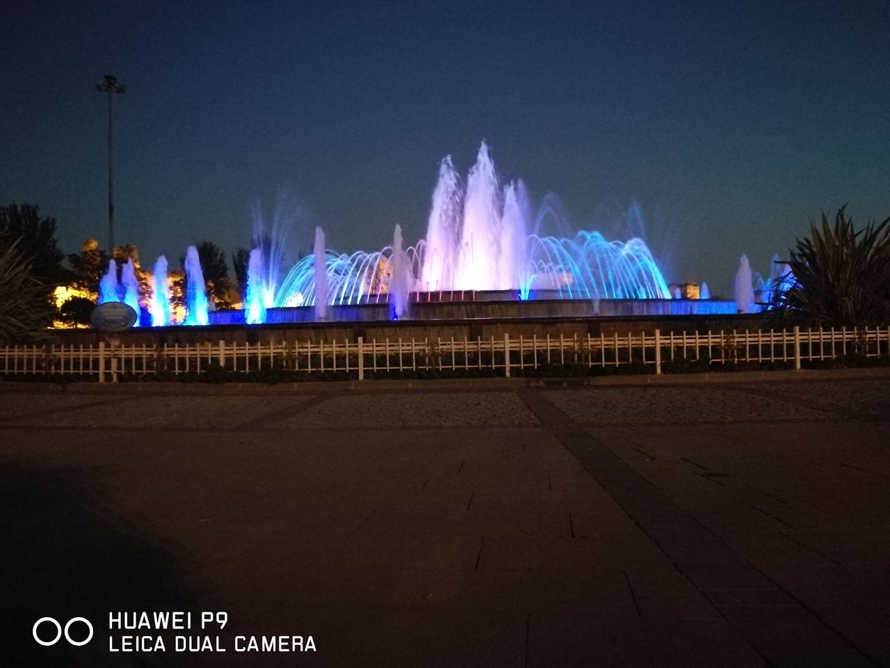 ILLUMINATED FOUNTAIN AGAINST SKY