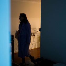 Woman standing in corridor