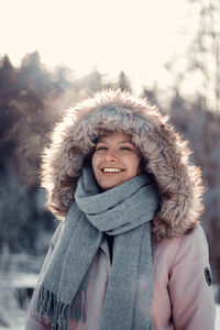 Portrait of a smiling young woman in snow