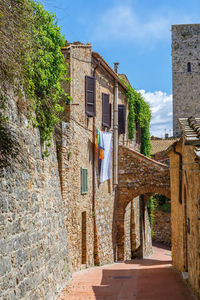 Alley with hanging laundry in an old italian village