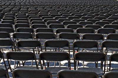 Full frame shot of empty chairs in row