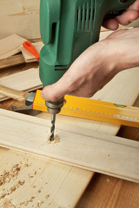 Close-up of man working on wood