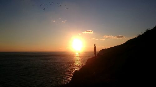 Scenic view of sea at sunset