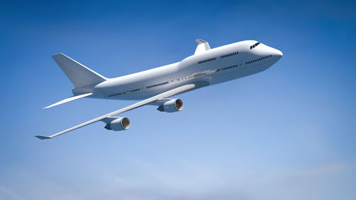 Low angle view of airplane flying in sky