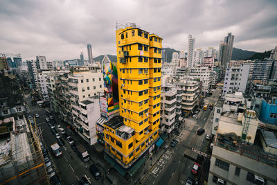 High angle view of city buildings against sky