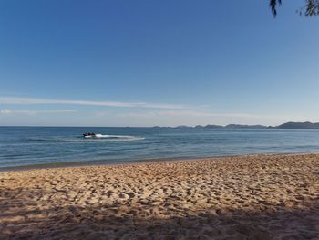 Scenic view of beach against clear sky