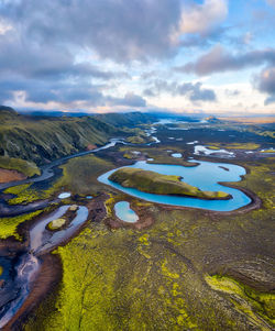 Aerial view of lake against cloudy sky