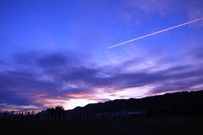 Scenic view of landscape against cloudy sky