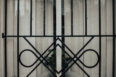 Metal grate on window of building
