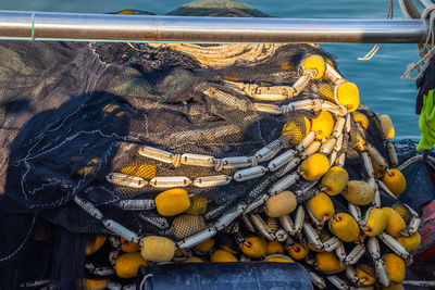 A fishing net with ropes and cord on the deck of a fisherman's boat