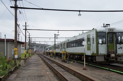 Trains at shunting yard against sky