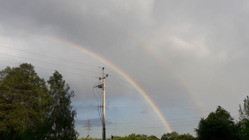 Low angle view of rainbow against sky