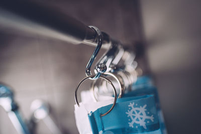 Close-up of curtain hanging in bathroom