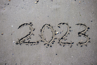 High angle view of footprints on sand