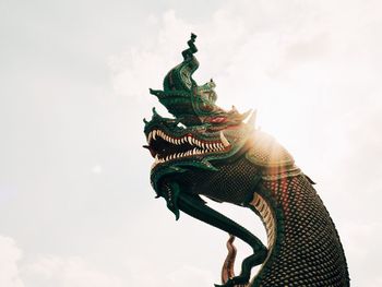 Low angle view of statue against sky