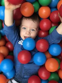 Portrait of cute boy with colorful balloons