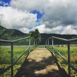 Scenic view of mountains against cloudy sky