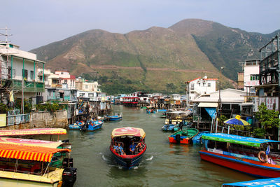 Boats moored at dock