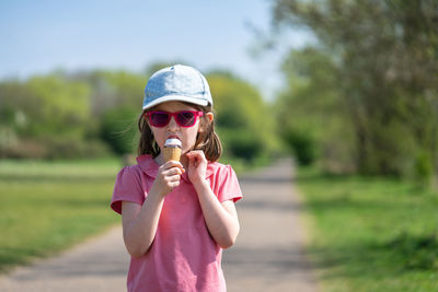 Midsection of woman holding ice cream