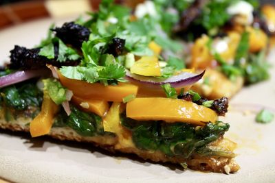 Close-up of pizza slice in plate