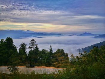 Scenic view of mountains against sky at sunset