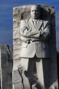 Low angle view of statue against sky