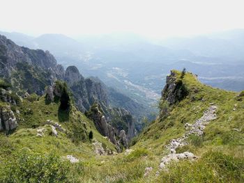 High angle view of valley and mountains against sky