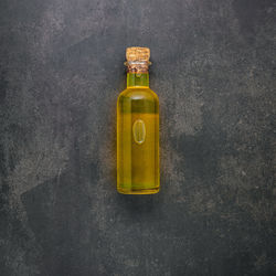 High angle view of bottle on table against wall