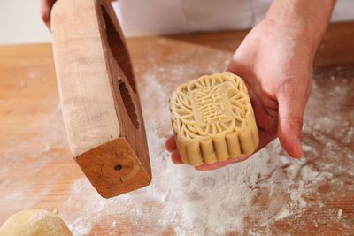 Close-up of man preparing food on cutting board