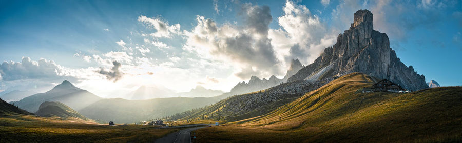 Panoramic view of mountains against cloudy sky