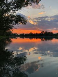 Scenic view of lake against sky during sunset