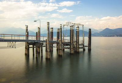 Pier over sea against sky