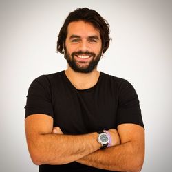 Portrait of smiling man against white background