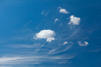 Generic white clouds on the blue sky . summer daytime clouds