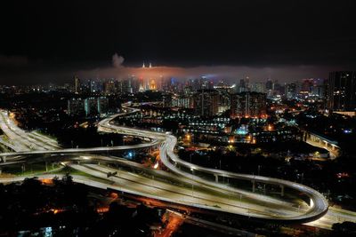 High angle view of illuminated city buildings at night