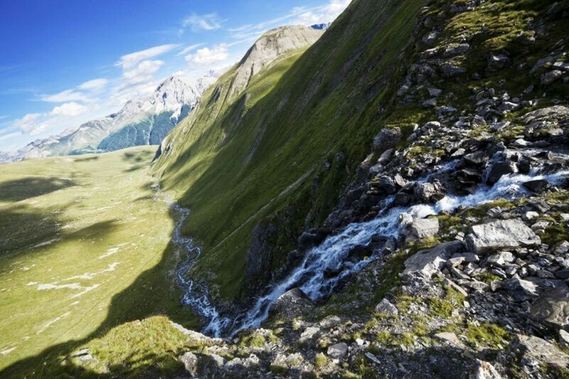 mountain, water, beauty in nature, scenics, tranquil scene, tranquility, nature, sky, rock - object, river, stream, landscape, non-urban scene, idyllic, day, green color, mountain range, outdoors, no people, rock