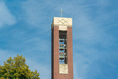 Low angle view of clock tower against sky