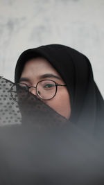 Portrait of woman in burka wearing eyeglasses