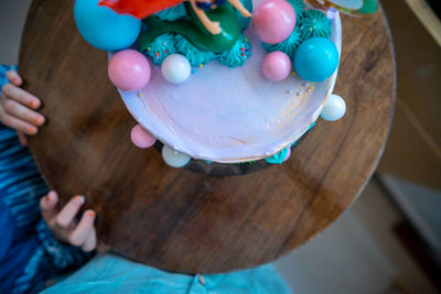 Underwater mermaid cake on the wooden table. top view.